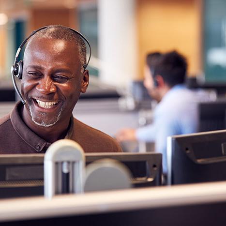 man with headset on in office space